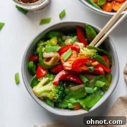 Pad Pak Thai in a white bowl with chopsticks
