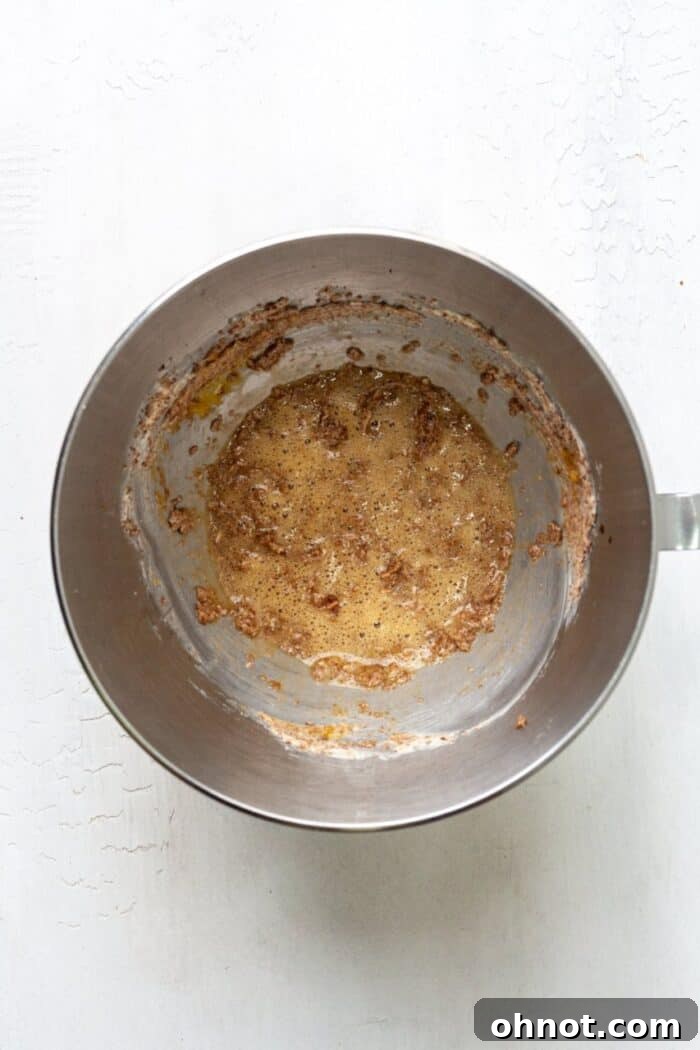 Eggs, vanilla, and baking soda mixed into the creamed butter and sugar.