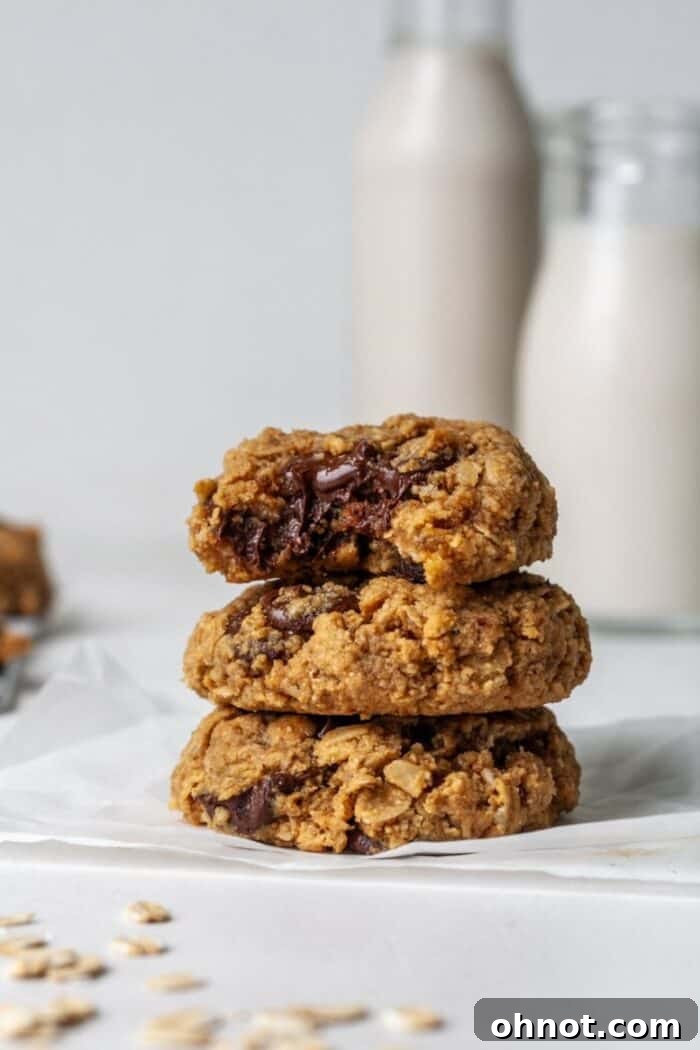 A stack of delicious almond flour oatmeal cookies with visible dark chocolate chips, showcasing their soft texture.