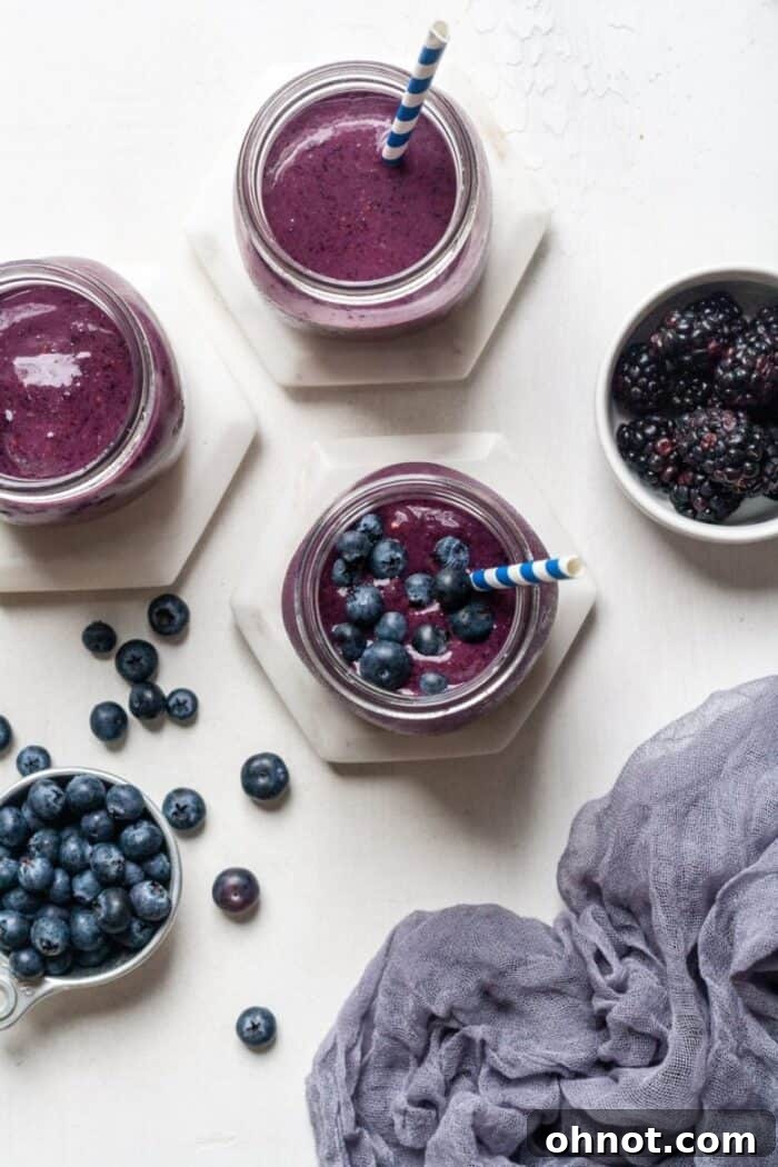 A refreshing Whole30 blueberry smoothie with a blue background, perfect for a healthy start to your day.