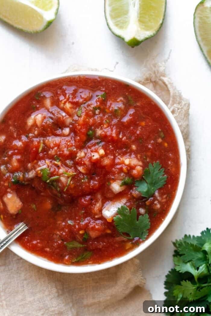 Keto salsa in a white bowl with cilantro garnish