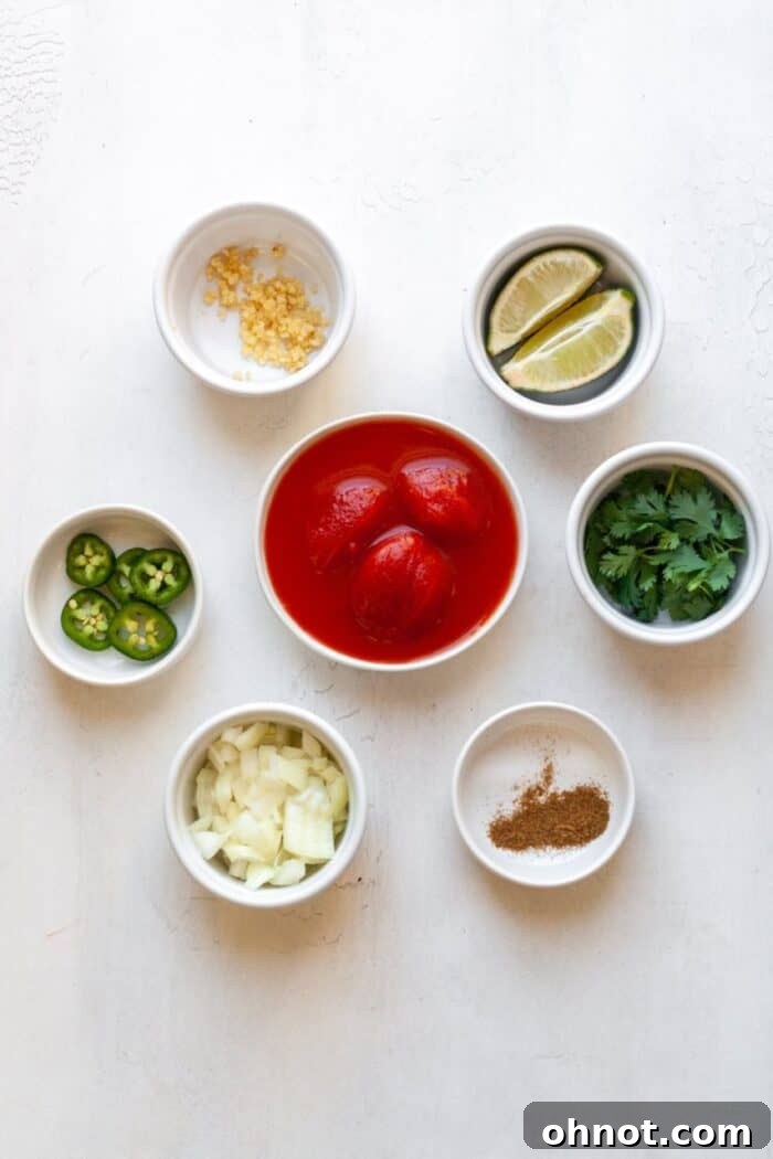 Ingredients for salsa arranged on a cutting board