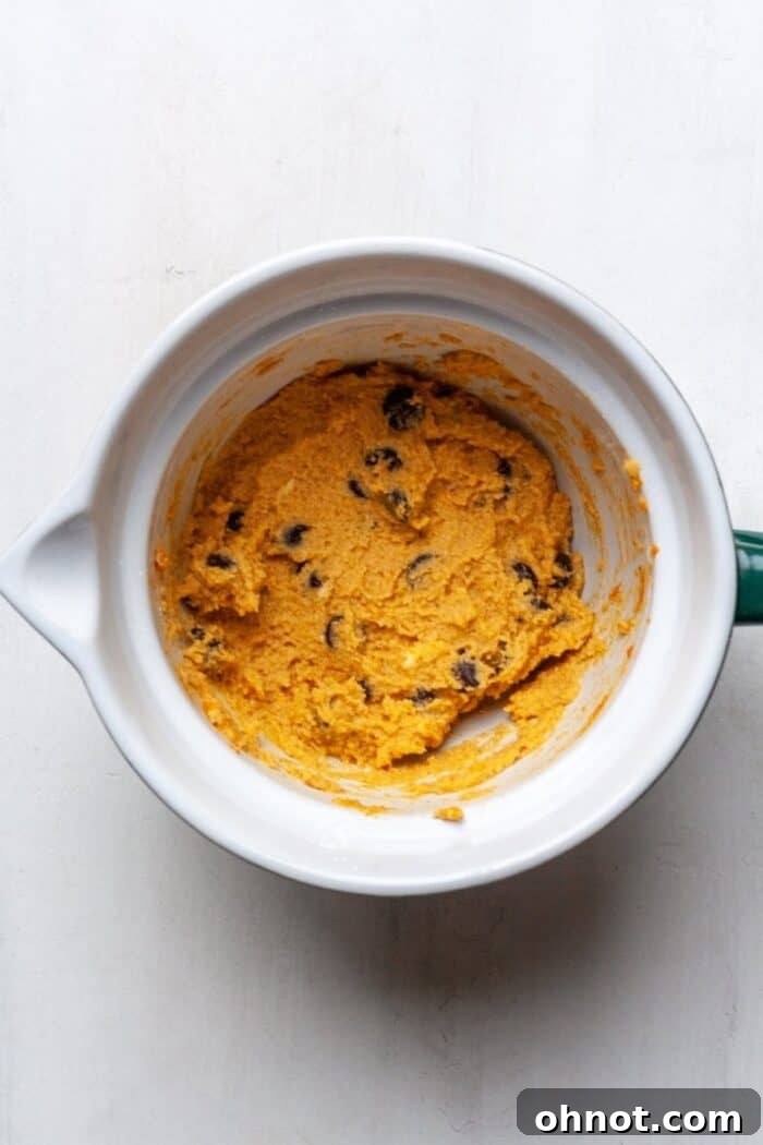Paleo pumpkin cookie dough with dark chocolate chips folded in
