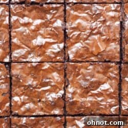 Gluten free dairy free brownies, showing a perfectly cut brownie with a gooey center