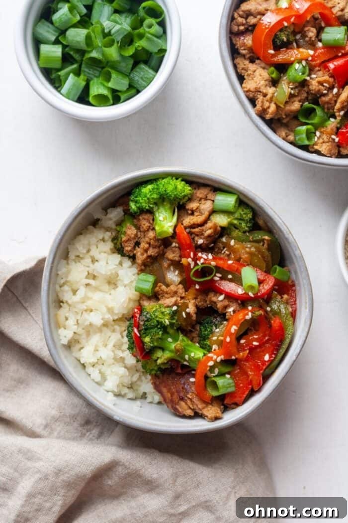 Completed turkey teriyaki bowls with cauliflower rice, ready to be served.