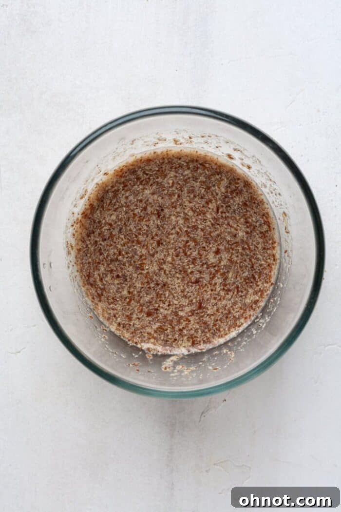 Flax eggs gelling in a small bowl, ready for use in the brownie batter