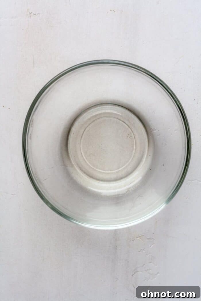 Melted coconut oil in a clear glass bowl