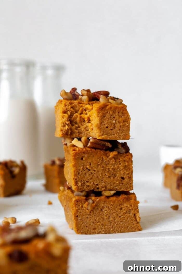 A delectable stack of perfectly baked sweet potato bars, showcasing their inviting texture and rich color.