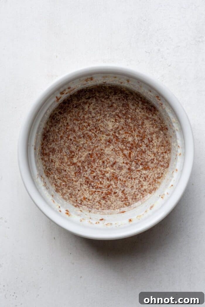 Flax egg mixture gelling in a bowl, ready for use in vegan baking