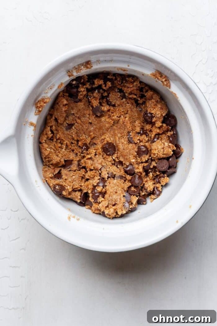 Vegan gluten free chocolate chip cookie dough chilling in a mixing bowl