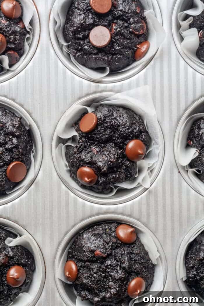 A full pan of beautifully baked Paleo chocolate dessert muffins, ready to be cooled and served.