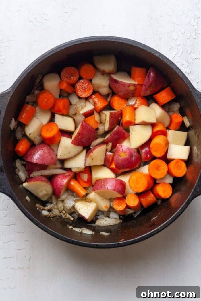 Carrots, potatoes and onions in Dutch oven