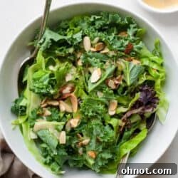 Kale crunch salad in bowl with dressing