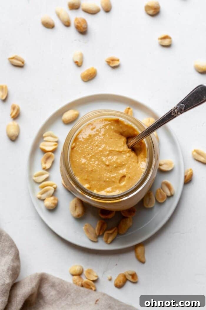 A glass jar of homemade Vitamix peanut butter, ready to be enjoyed.