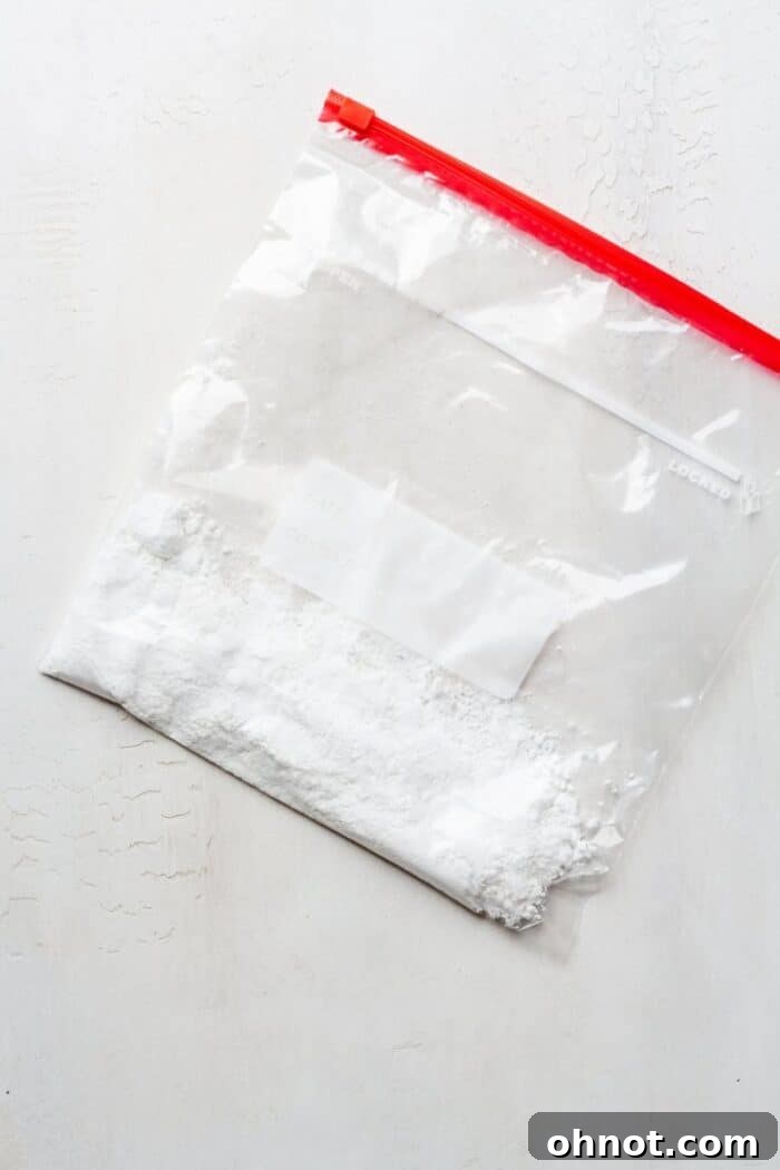 Powdered sugar carefully placed inside a large Ziplock bag, ready for the next step.