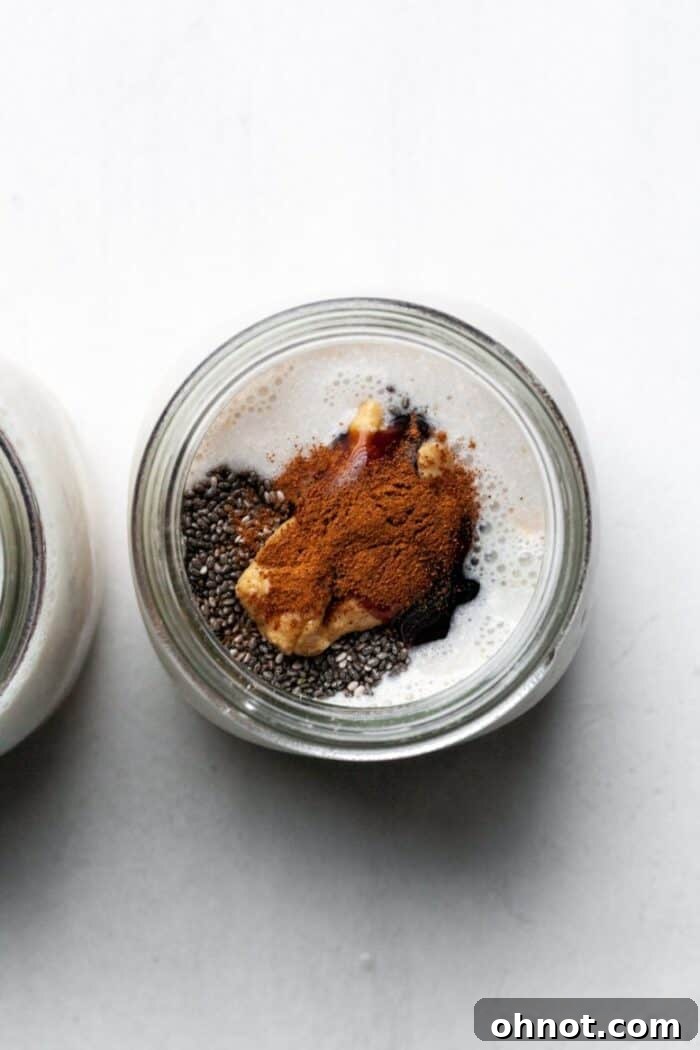 Overnight oats mixture with cinnamon and peanut butter visible