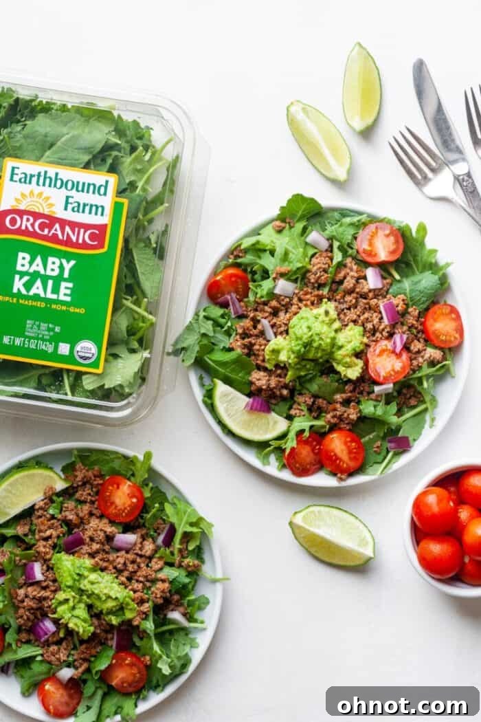 A Whole30 salad with seasoned taco meat and vegetables, separated for meal prep or storage.