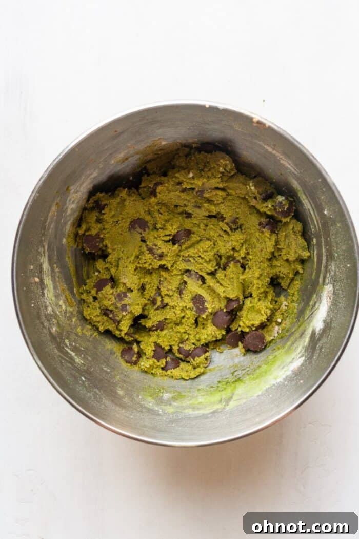 Matcha cookie dough with chocolate chips folded in