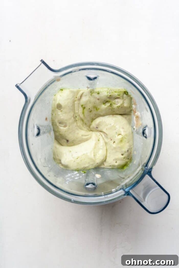 Green nice cream mixture blending in a Vitamix