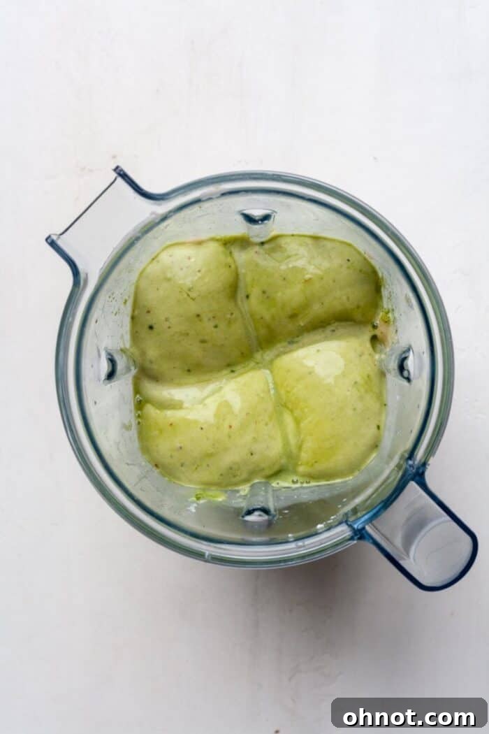 Smooth green nice cream mixture in a blender