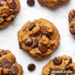 Vegan pumpkin chocolate chip cookies on a baking sheet, ready for serving.