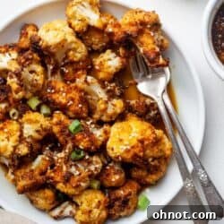 Teriyaki cauliflower bites on white plate