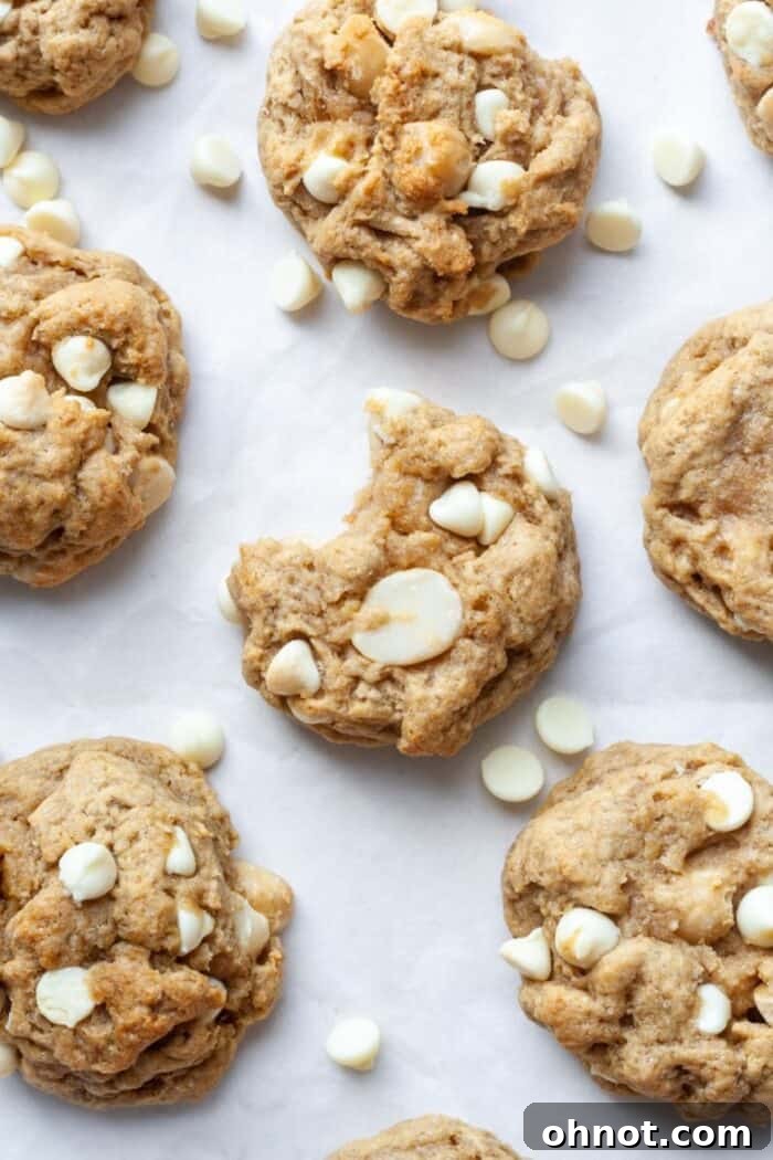 Close-up of Vegan cookies filled with creamy white chocolate chips and crunchy macadamia nuts.