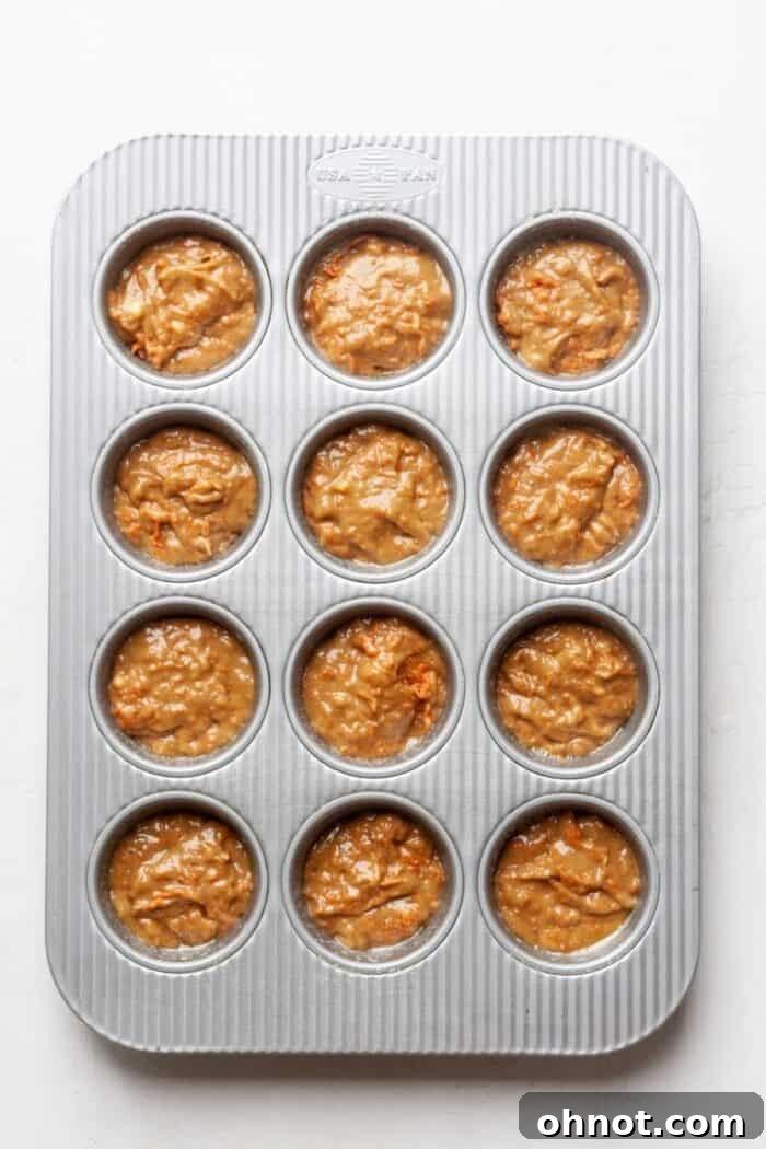 Carrot muffins in a pan, ready for the oven.