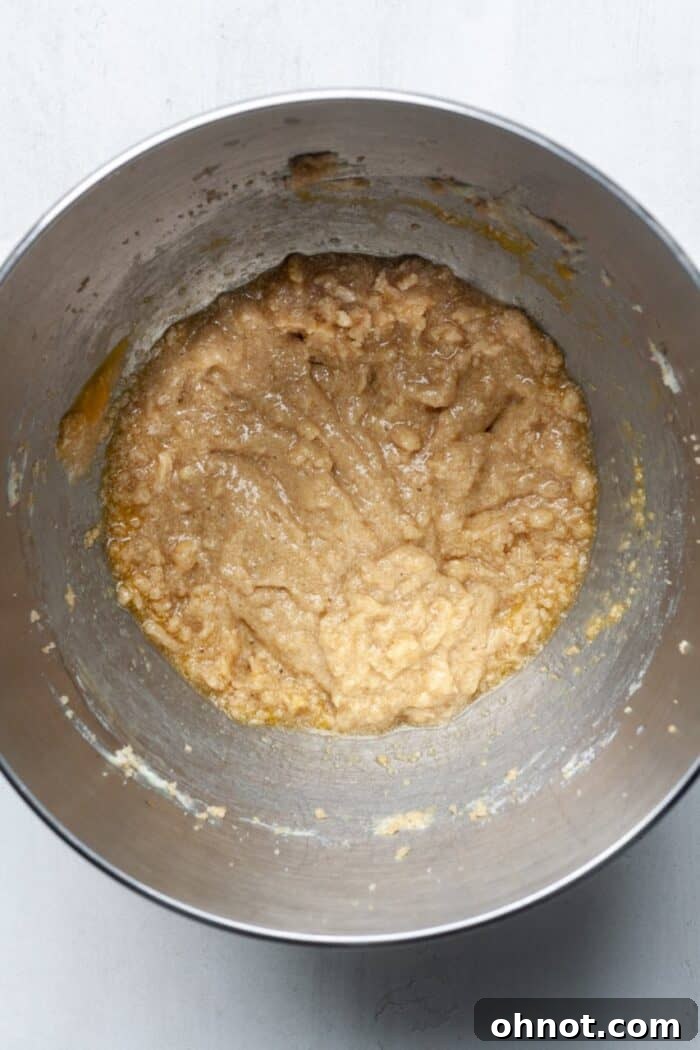 Egg, butter, and sugar mixture in a bowl, ready for dry ingredients