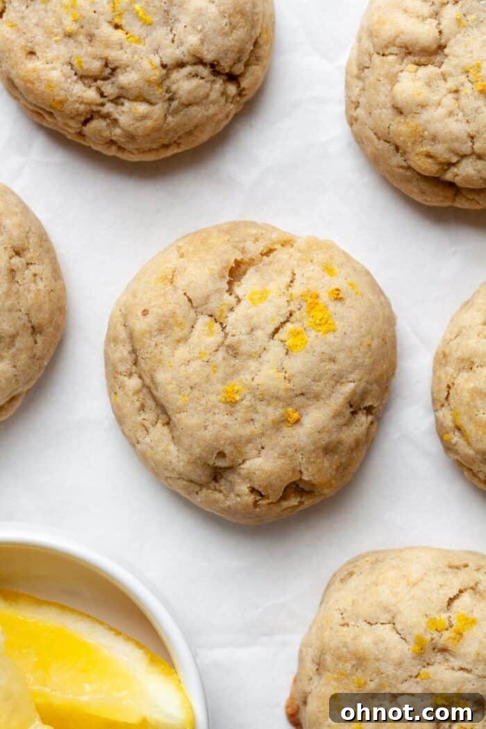 Freshly grated lemon zest adorning vegan lemon cookies before baking.