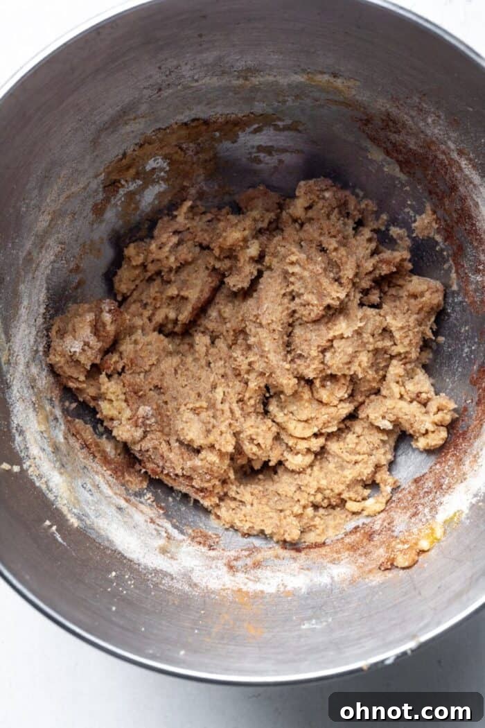 Thick gluten-free donut batter in a mixing bowl, prior to adding apple cider