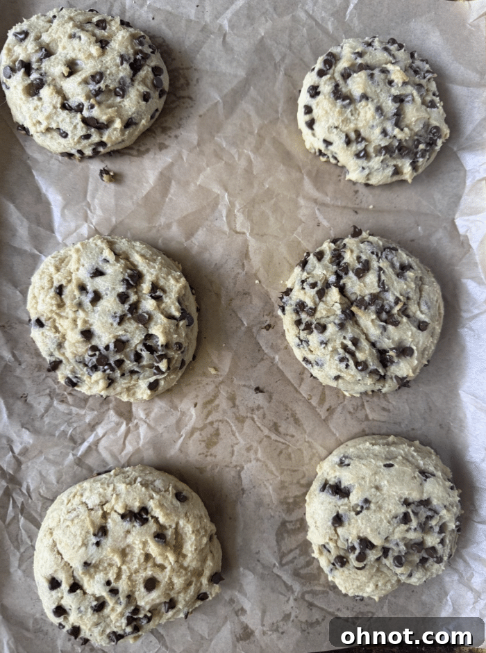 Freshly baked Greek yogurt cookies cooling on a wire rack.