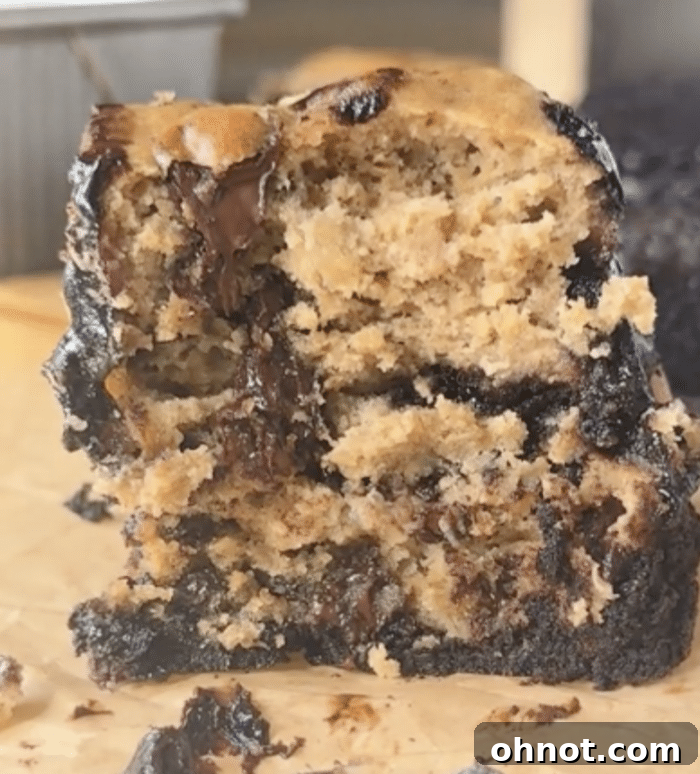 A bite of banana bread brookies, showing the swirl of chocolate and banana.