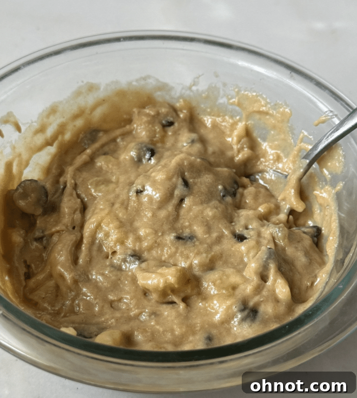 Banana batter in a small bowl, ready for mixing.