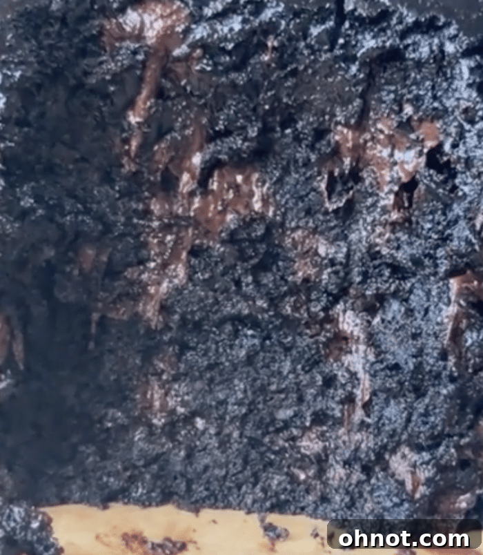Close up of a date brownie with chocolate chips.