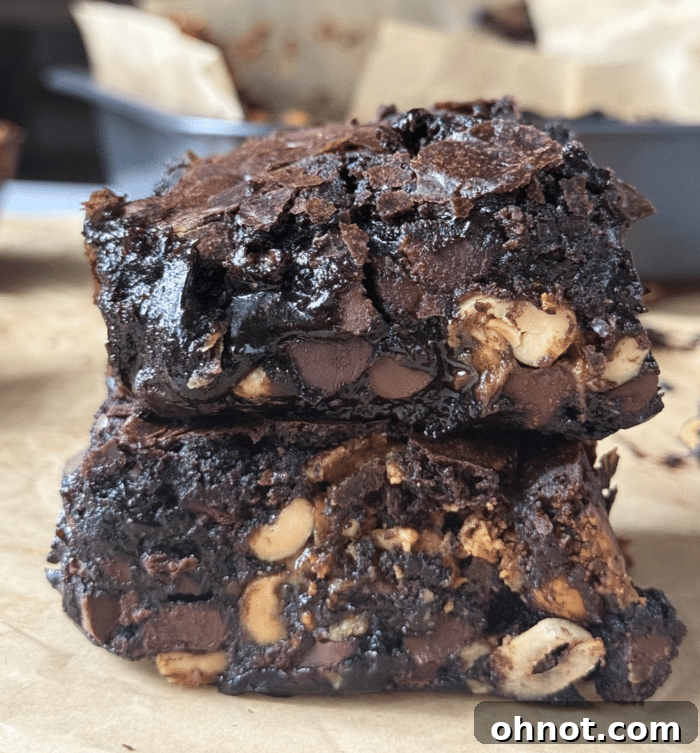Decadent Snickers Brownies with Visible Layers of Chocolate, Peanut Butter, Caramel, and Peanuts