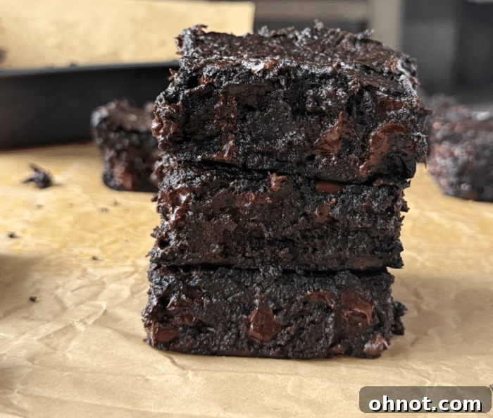 A stack of gooey, delicious sweet potato protein brownies.