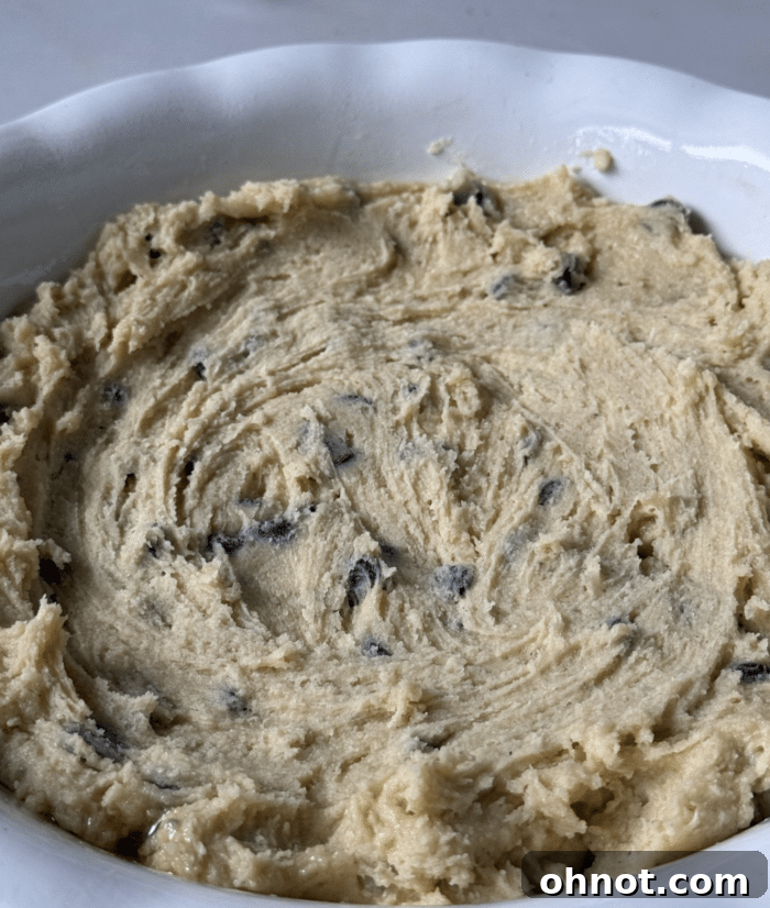 First layer of gluten-free cookie dough pressed into a pie plate.