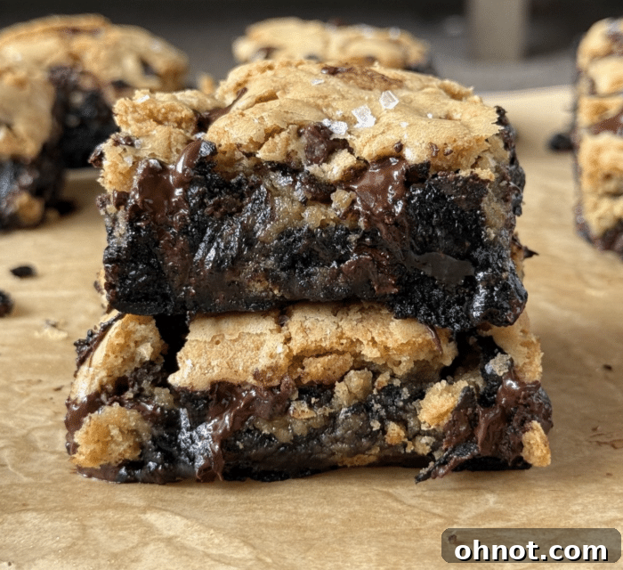 A stack of perfectly cut cookie brownies, showcasing their beautiful layers.