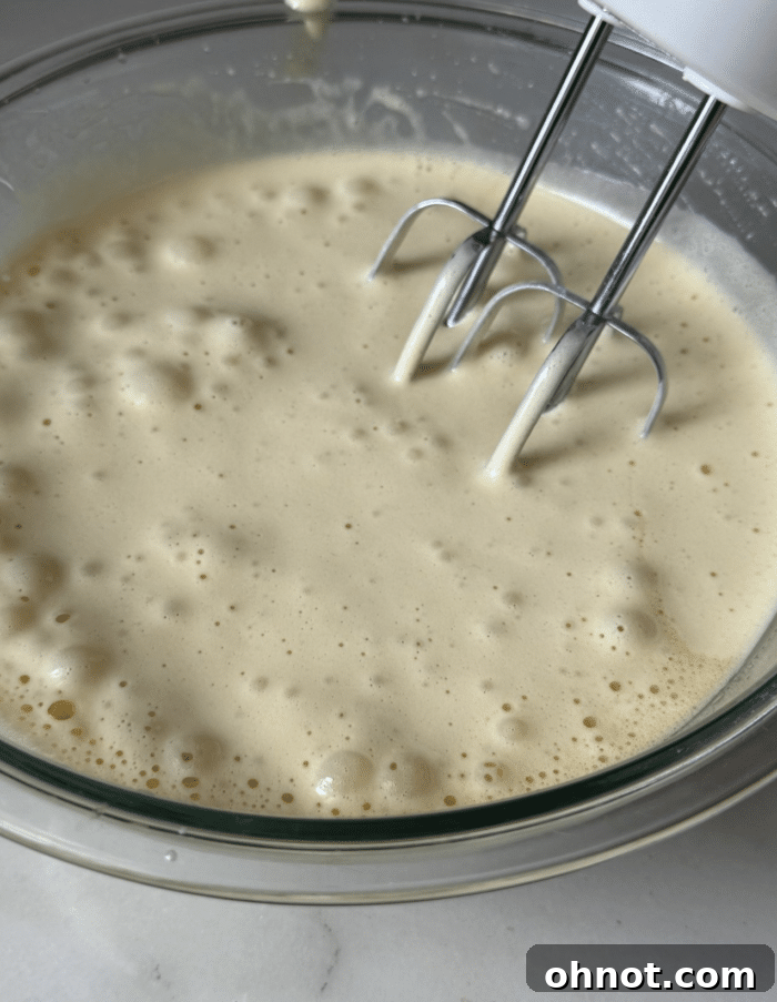 Electric mixer with eggs.
