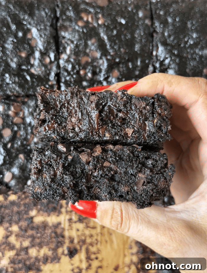 Hands with zucchini bars.