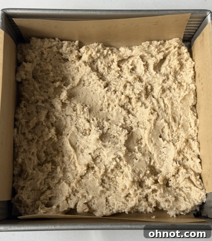 Cake batter in square pan.