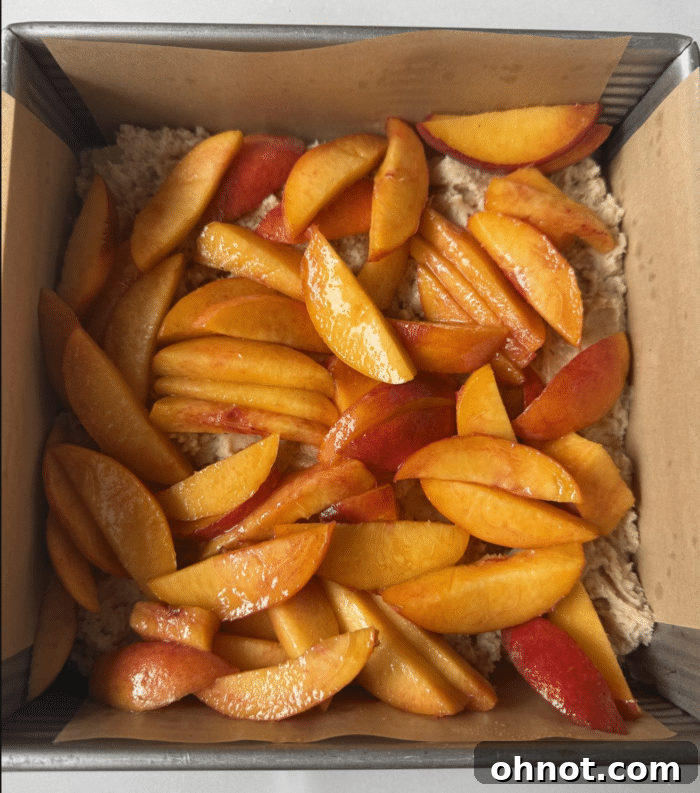 Sliced peaches in pan.