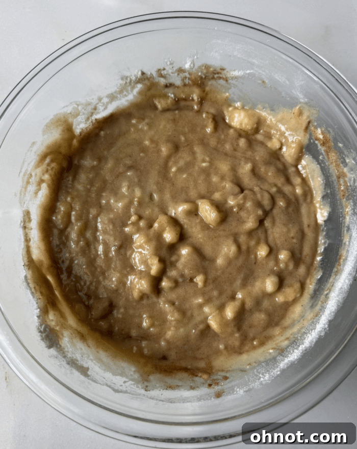 Mashed banana batter in bowl.